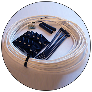 Kitting White wire with black accessories and components, assembled in a kit.